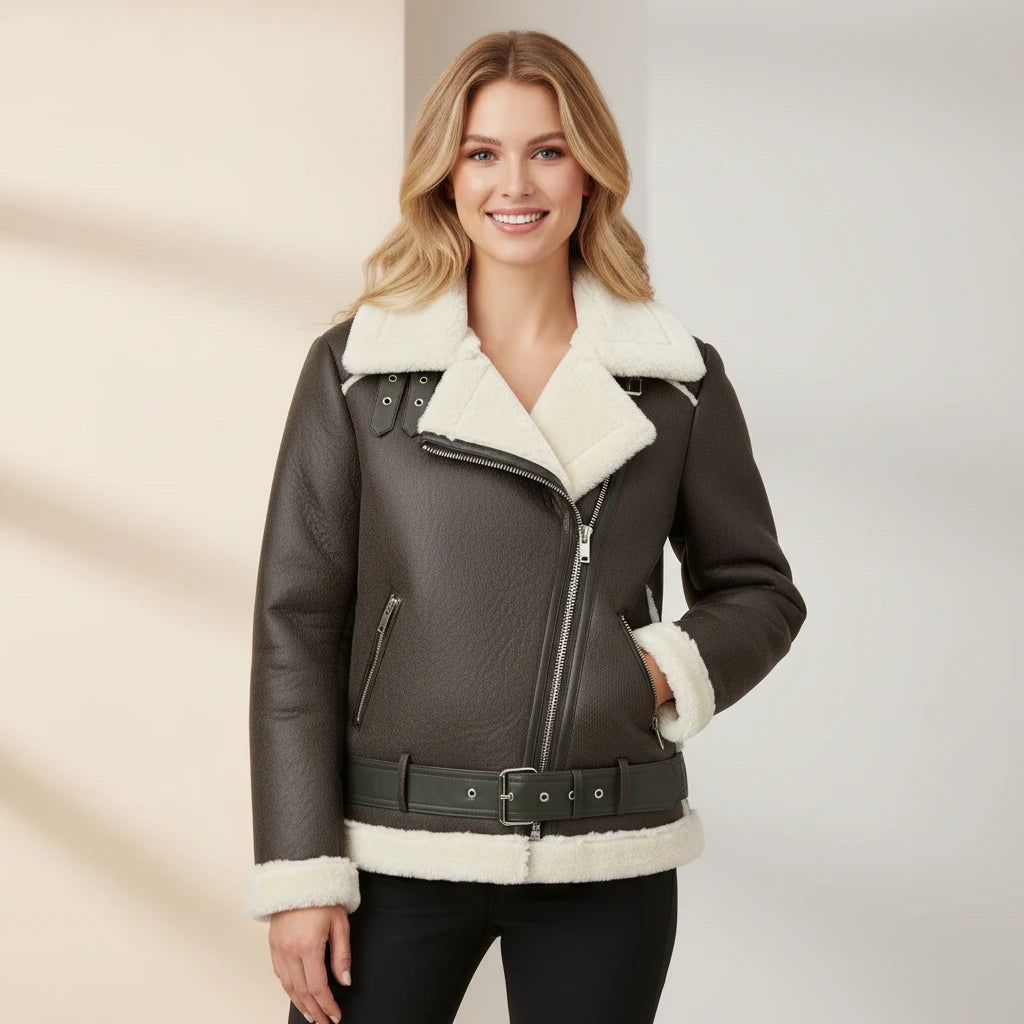 Woman wearing a black leather jacket with white fur trim on a neutral background